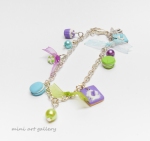 Mini food charm bracelet / miniature sweets mini food jewelry colorful / wafer, cup cake, tart, marshmallow, macaron / orange, blue, green side