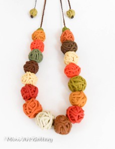 Minimalistic necklace with polymer clay ooak handmade beads yarn ball thread in autumn fall colors and macrame braiding orange